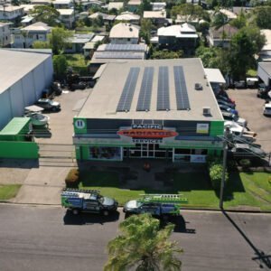An aerial view of a building in Cairns with solar panels on the roof.