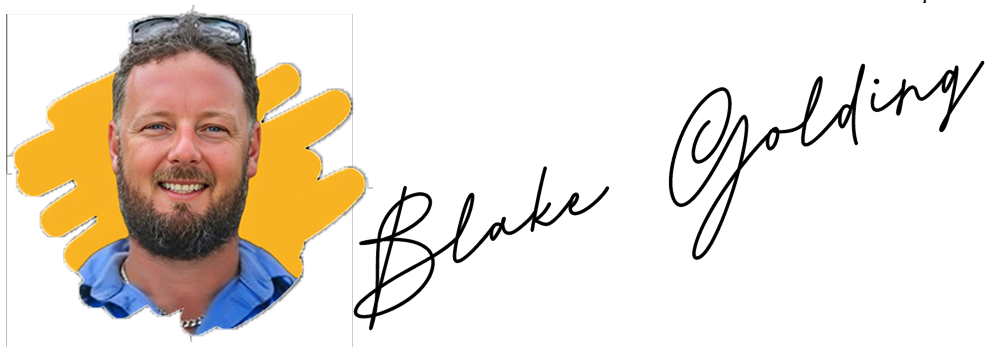 A smiling bearded man with sunglasses on his head stands before a yellow background in Cairns, near the name “Blake Golding.”.