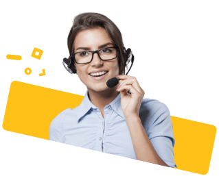 A woman in Cairns wears glasses and a headset, smiling with a microphone. She’s in a light blue shirt before a yellow geometric backdrop.
